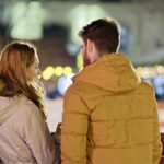 merry christmas, couple, young people, people, blonde, friendship, together, talking, fence, winter, holiday, lights, ornaments, decoration, back view, snapshot